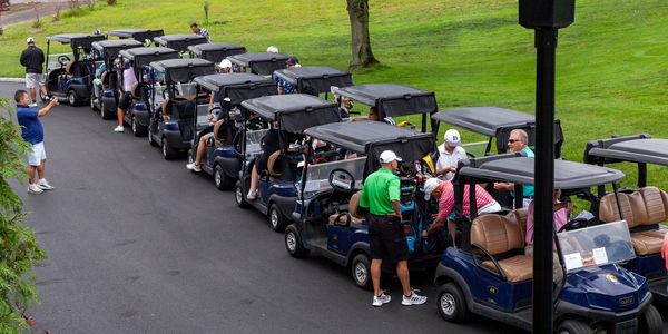 Golf carts lined up for the RAM Memorial