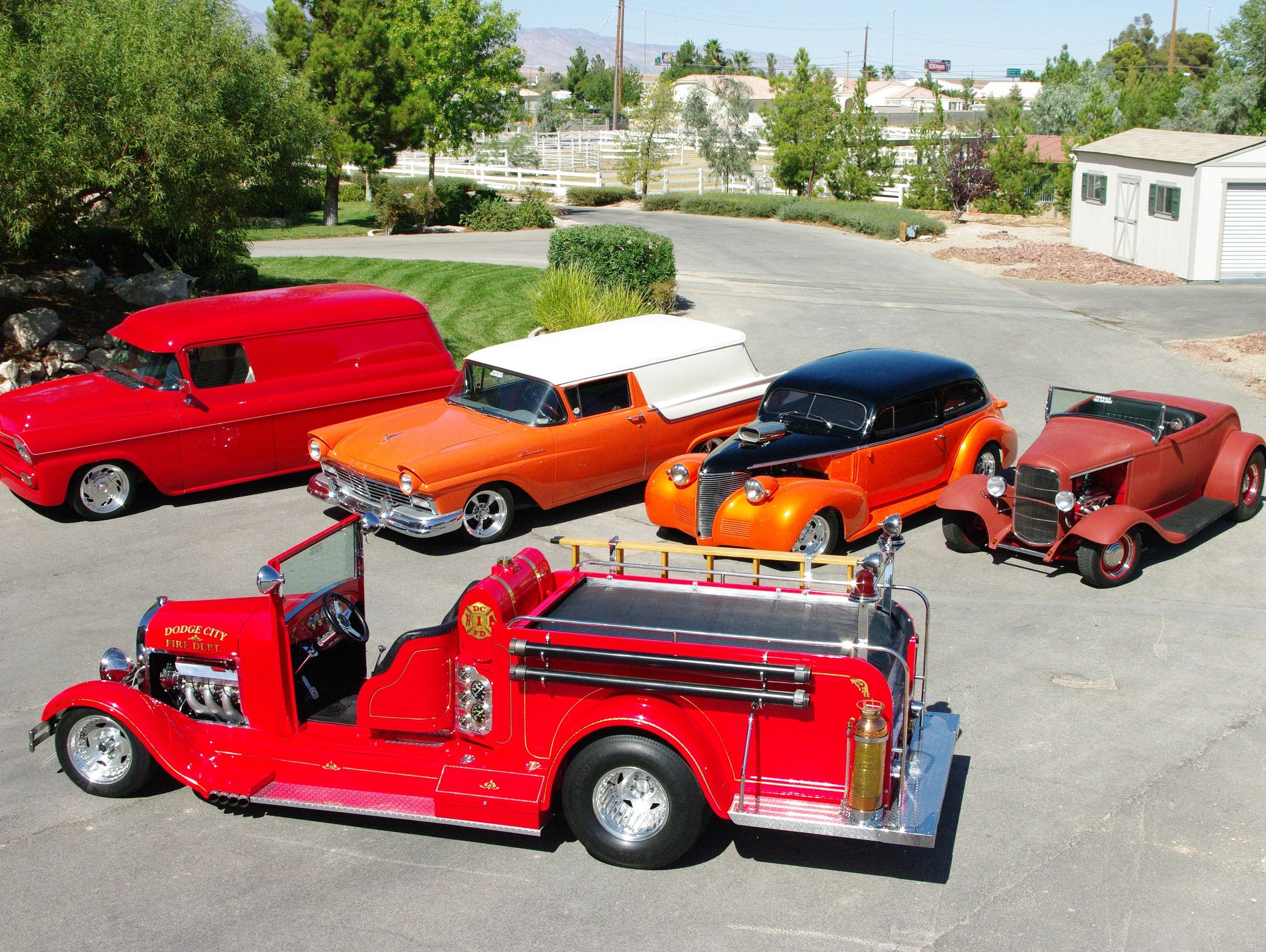 Group photo of five vehicles with a '29 Fire Engine in the foreground.