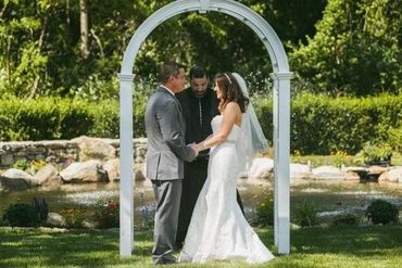 Couple getting married under the arch