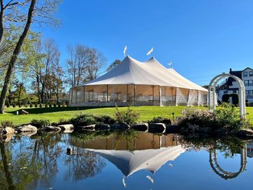 Large Sperry tent overlooking fountain pond