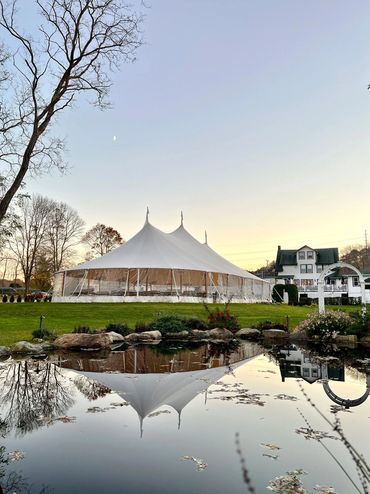 Large tent overlooking fountain pond