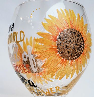 In a world full of roses be a sunflower artwork.