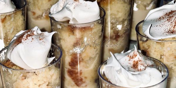 a close up of traditional tres leches cake shots at nighttime