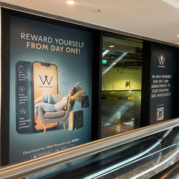 Advertisement for Wafi Rewards app offering points and VIP privileges from day one.