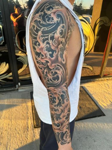 Traditional Japanese sleeve tattoo finger waves 