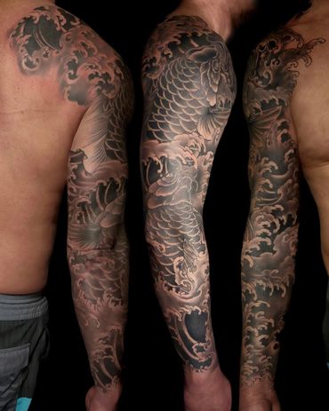 Traditional Japanese fish and wave tattoo sleeve