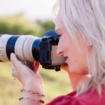 Woman looking through camera