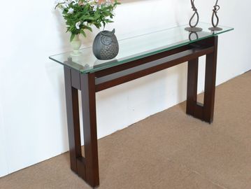 Modern console table with glass top and wooden legs.
