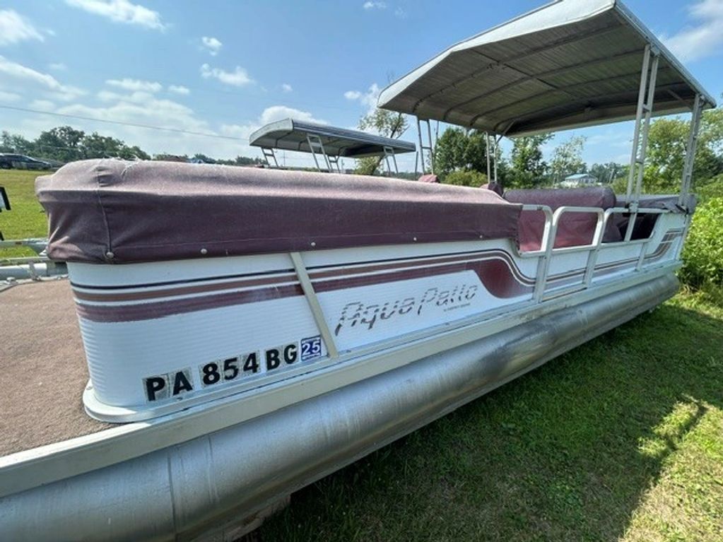 A pontoon boat named Aqua Patio.