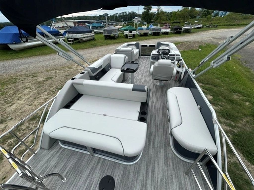 Interior view of a modern pontoon boat with white seating.