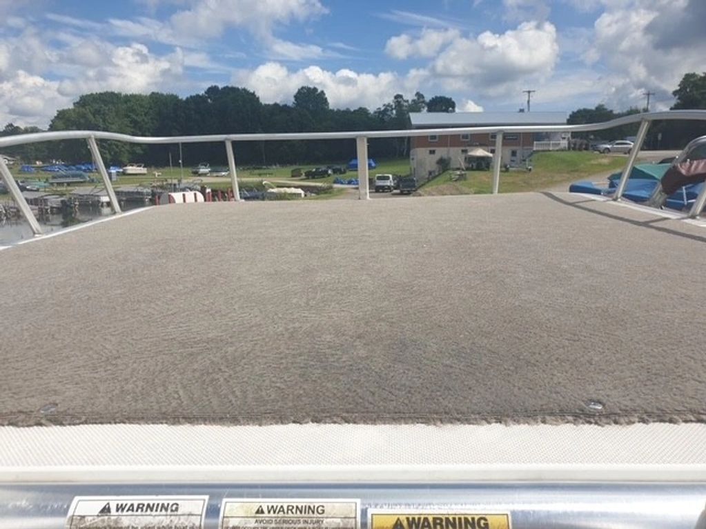 View from a boat deck at a lakeside marina.