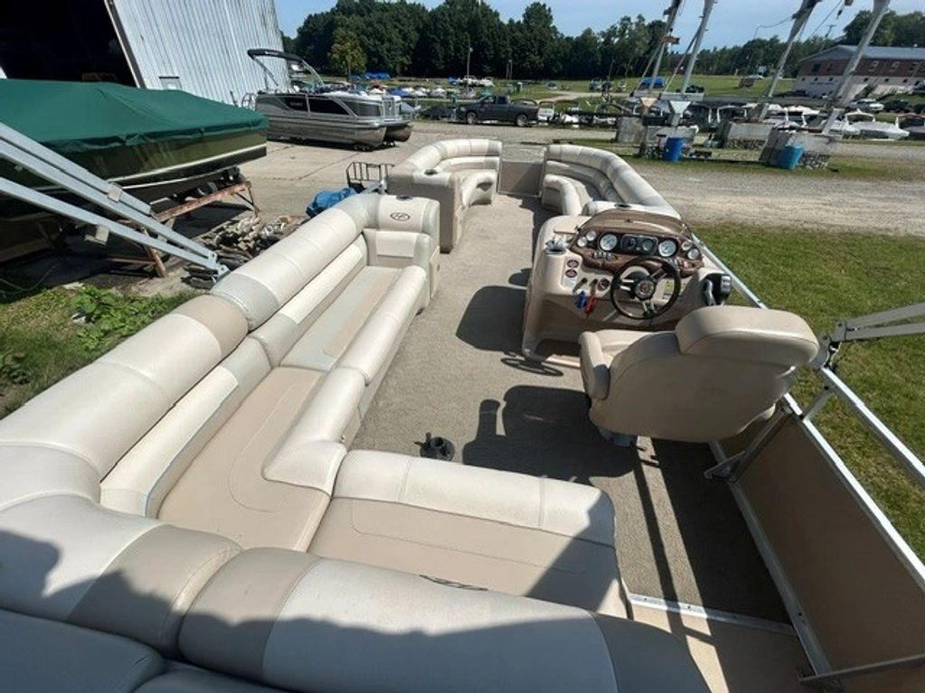 Interior seating and controls of a pontoon boat.