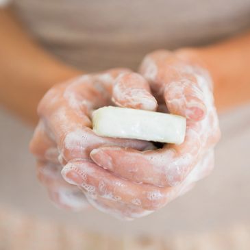 Caregiver washing hands for good hygiene