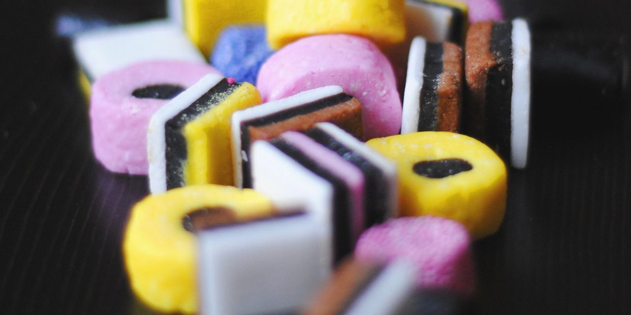selection of colourful sweets on black table