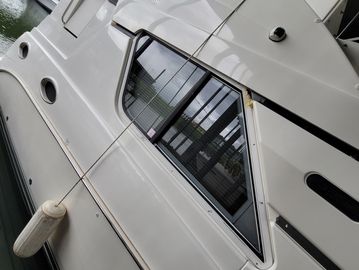 Side view of a docked Silverton boat.