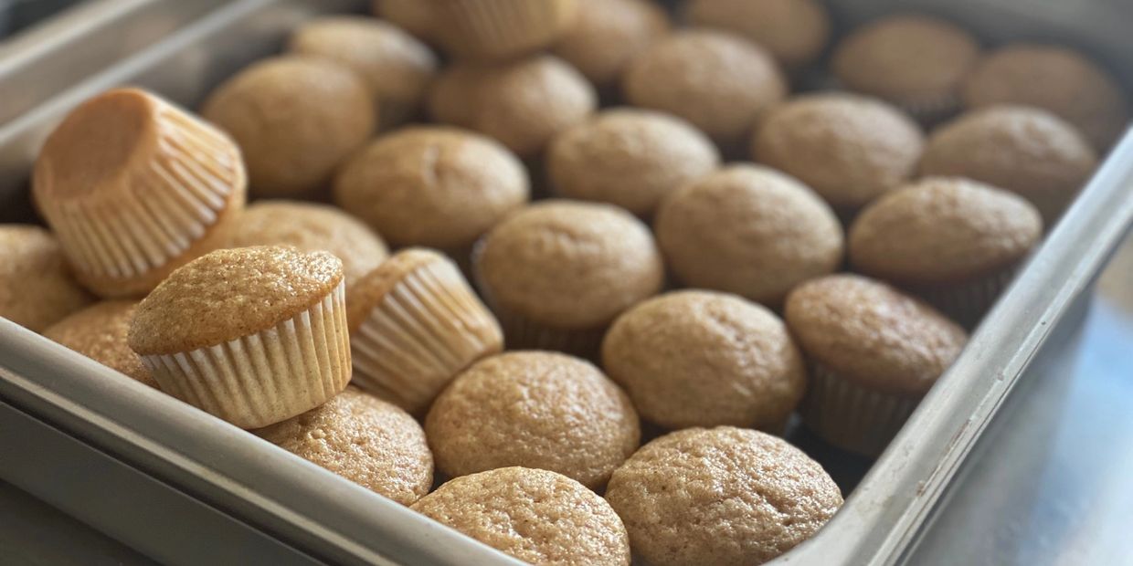 Tray of freshly baked cupcakes.
