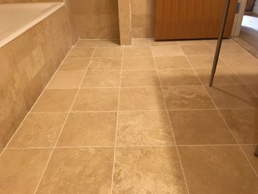 Re-grouting, Thinset clean-up, replacement of broken shower door bumper, custom milled & installed
