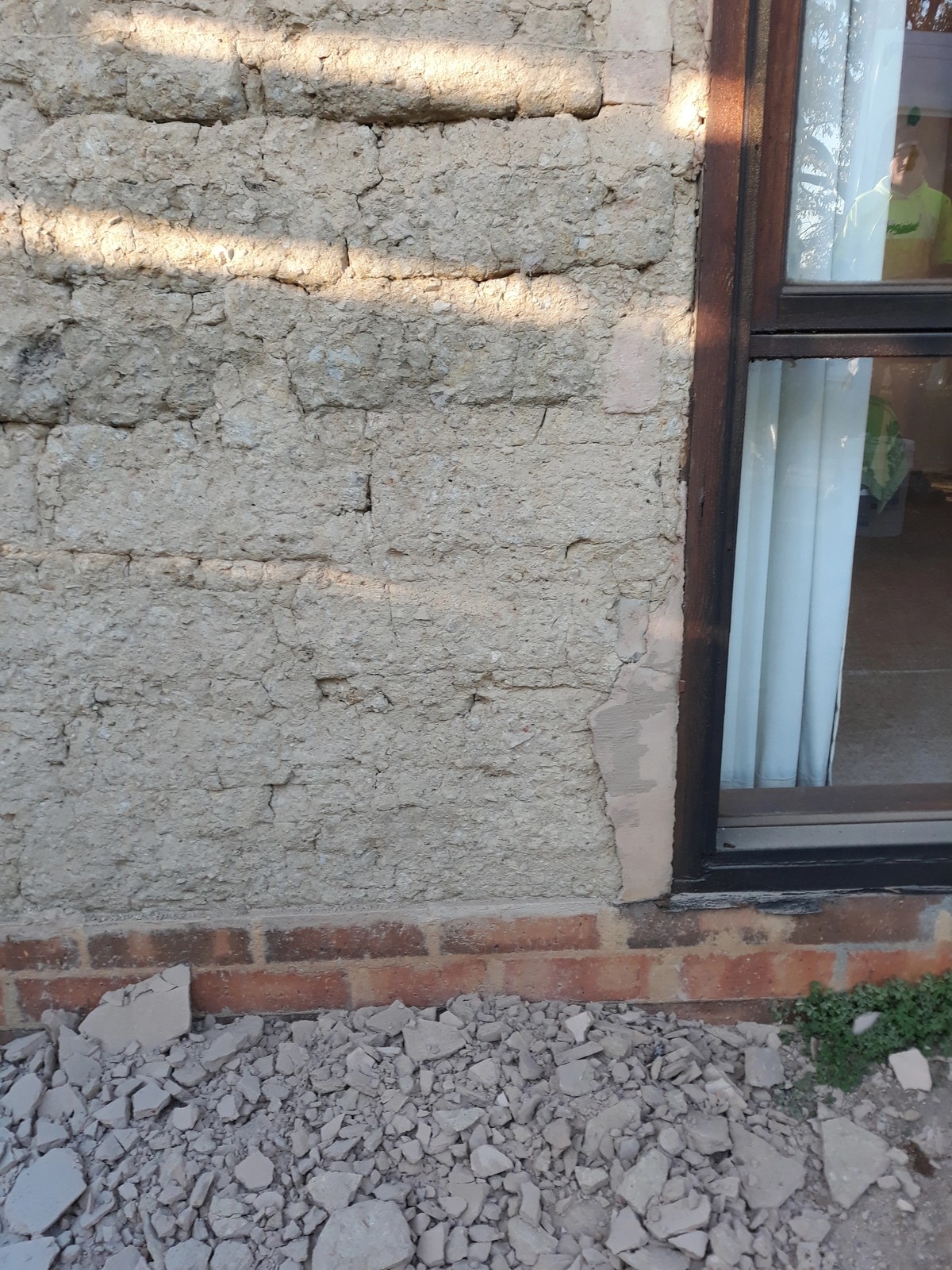Mud brick wall section restored