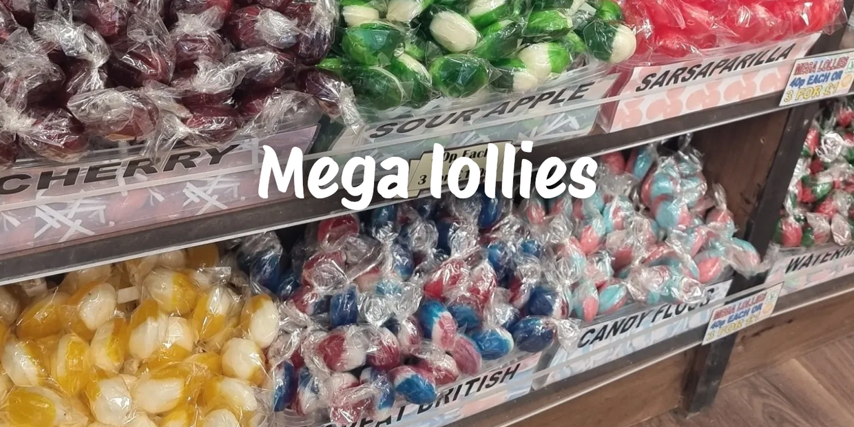 Assorted mega lollies in plastic wrap on display.