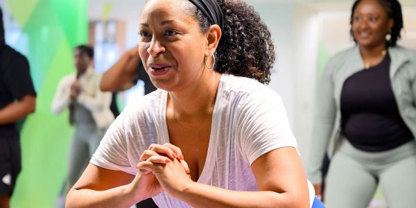 Woman exercising in a group fitness class.