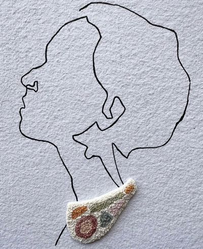 Minimalist line drawing of a woman's profile with a textured, colorful earring.