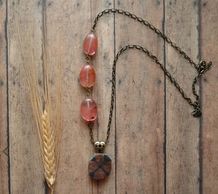 cherry fire agate with chiastolite cross pendant and brass scrolled heart bail