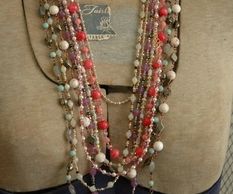 Multiple strands of hand beaded semi-precious stone layering necklaces.