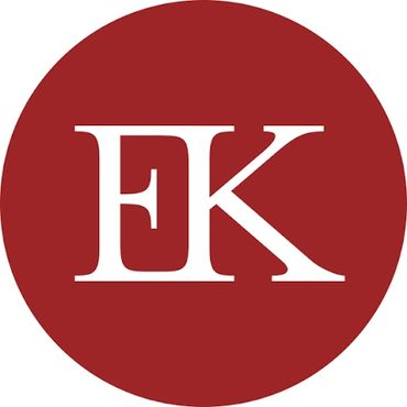 White EK letters on a red circle background.