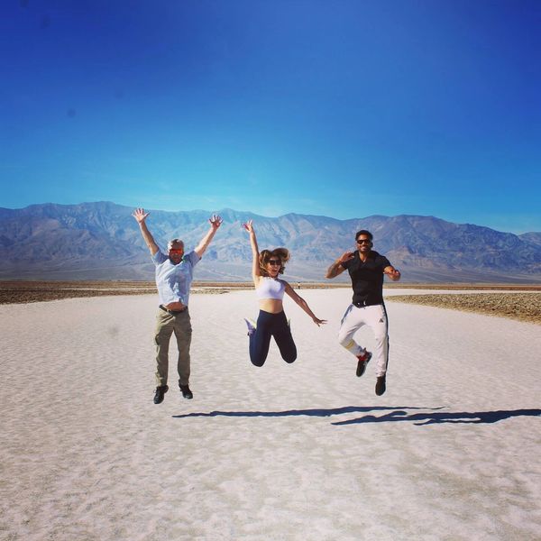 Three individuals jumping ecstasy in Death Valley 