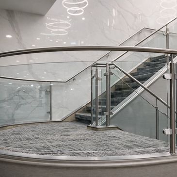 custom made curved stainless steel and glass railing for commercial project in Toronto