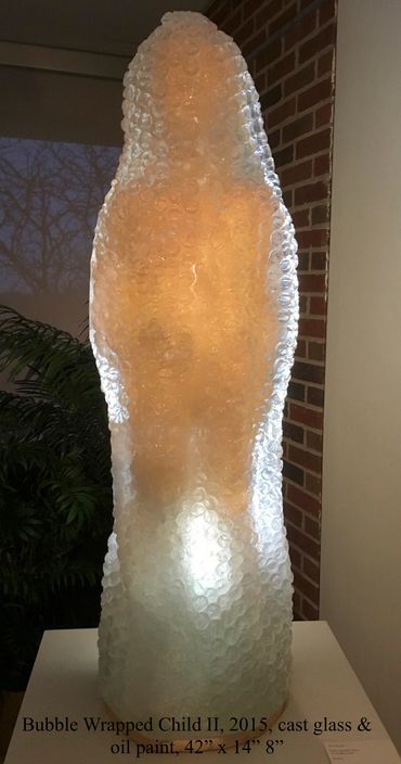 Bubble Wrapped Child II, 2015, cast glass & oil paint, 42" x 14" x 8"