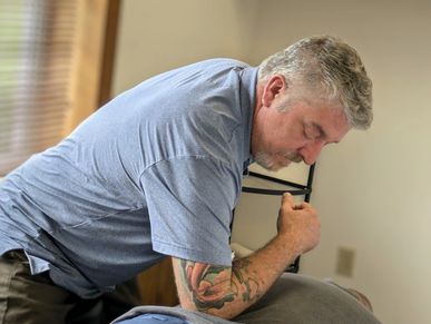 Chiropractor Rob Fair adjusting a patient