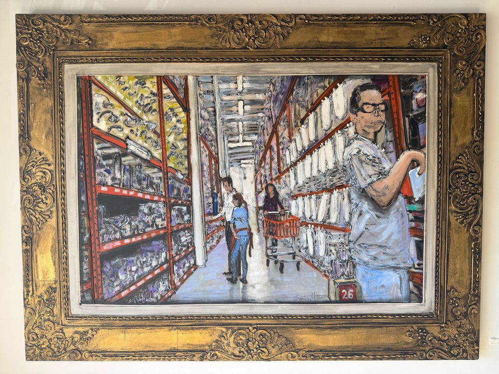 Painting of people shopping in a store aisle with ornate frame.