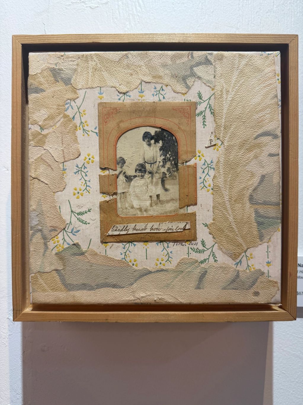 Framed vintage collage featuring a black-and-white photo of three children.