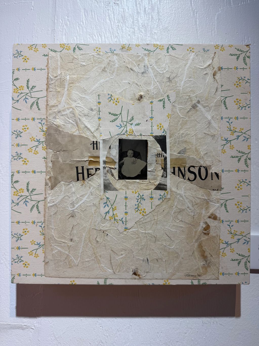 Mixed media collage with vintage photo and floral patterns.