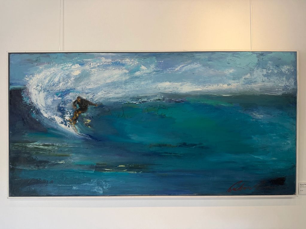 Abstract painting of a surfer riding a large wave in vibrant blues and whites.