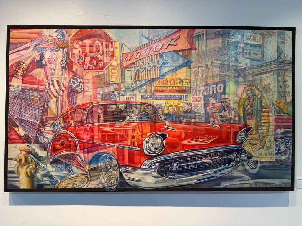 Vibrant mural featuring a classic red Chevrolet in a bustling urban scene with diverse cultural elements.
