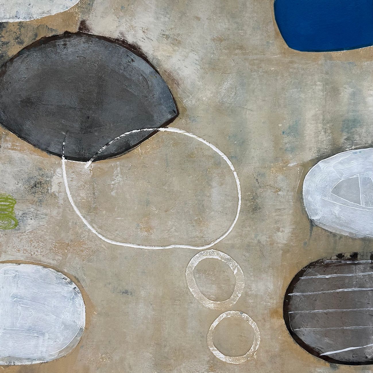Abstract art featuring overlapping shapes and circles on a textured beige background.
