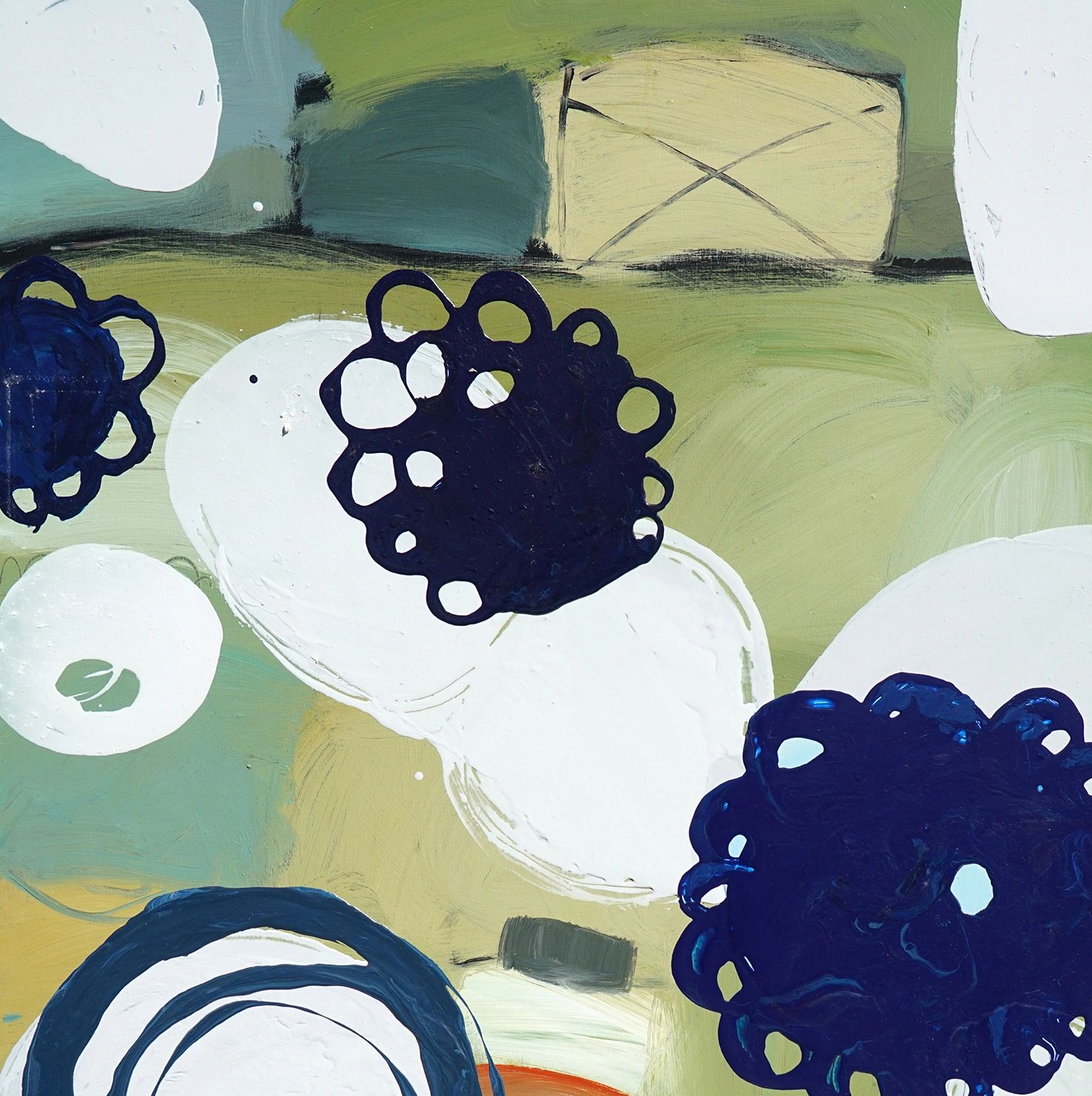 Abstract painting with white ovals and dark blue circular shapes on a green background.