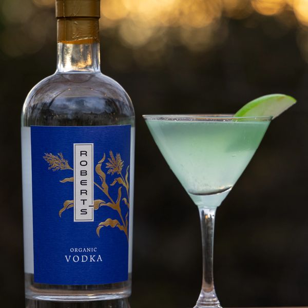 Bottle of Roberts Organic Vodka with a cocktail glass.