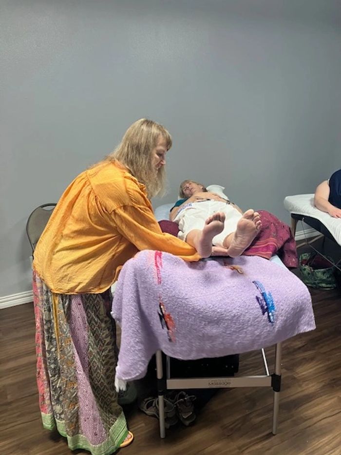 Sheila Baskett gives an Star Energy Chakra Healing session to a new client on July 27, 2025.