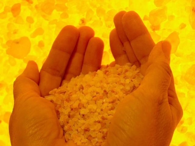 Close-up of hands holding salt