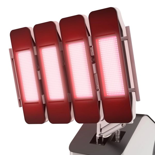 Close-up of a red LED light therapy device with four illuminated panels.