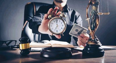 photo of a man holding a clock