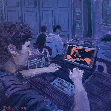 Person playing a game on a laptop in a dimly lit room.