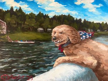 Dog enjoys boat ride with American flag bandana.