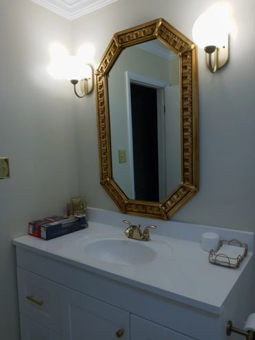 A tall bathroom mirror