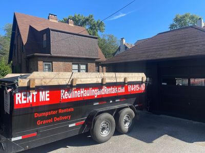 Redline Hauling 15-yard dumpster trailer in a residential driveway for a Central Ohio cleanout.