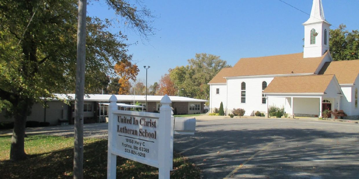 United In Christ Lutheran School with a church and clear sky.