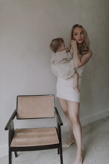 Candid moment between mother and daughter, photographed at home with natural light. storytelling/